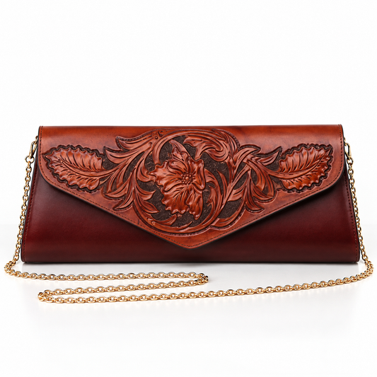 A brown tooled leather clutch bag with a gold-tone chain strap, featuring an embossed floral design on the front flap.