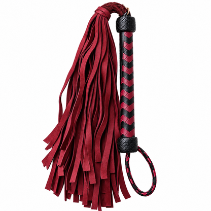 A red and black leather flogger with a long tassel, a braided handle, and a looped whip cord, shown against a plain white background.