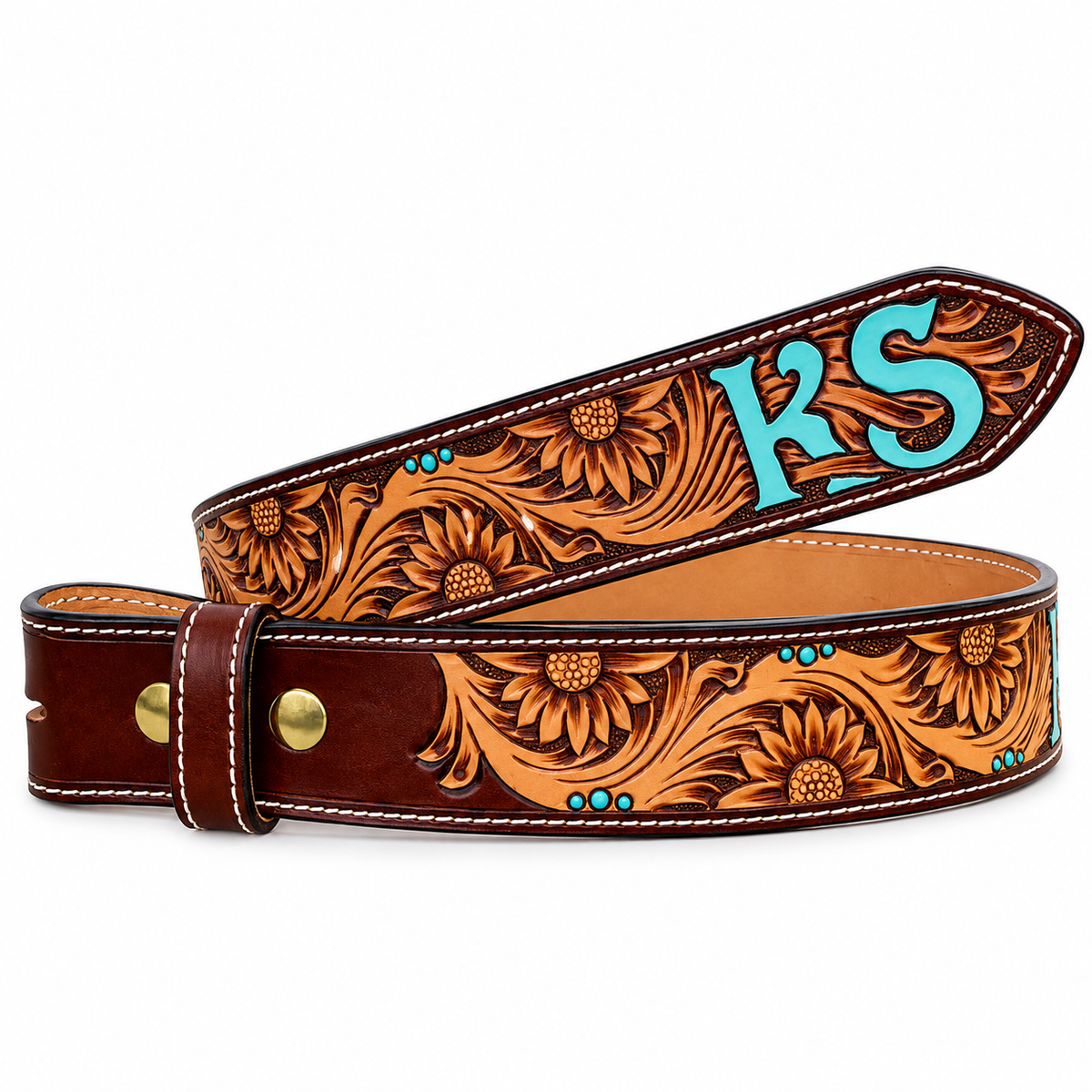 A tooled leather belt with floral sunflower designs and turquoise monogram initials 'KS' on the keeper, displayed on a clean white background.