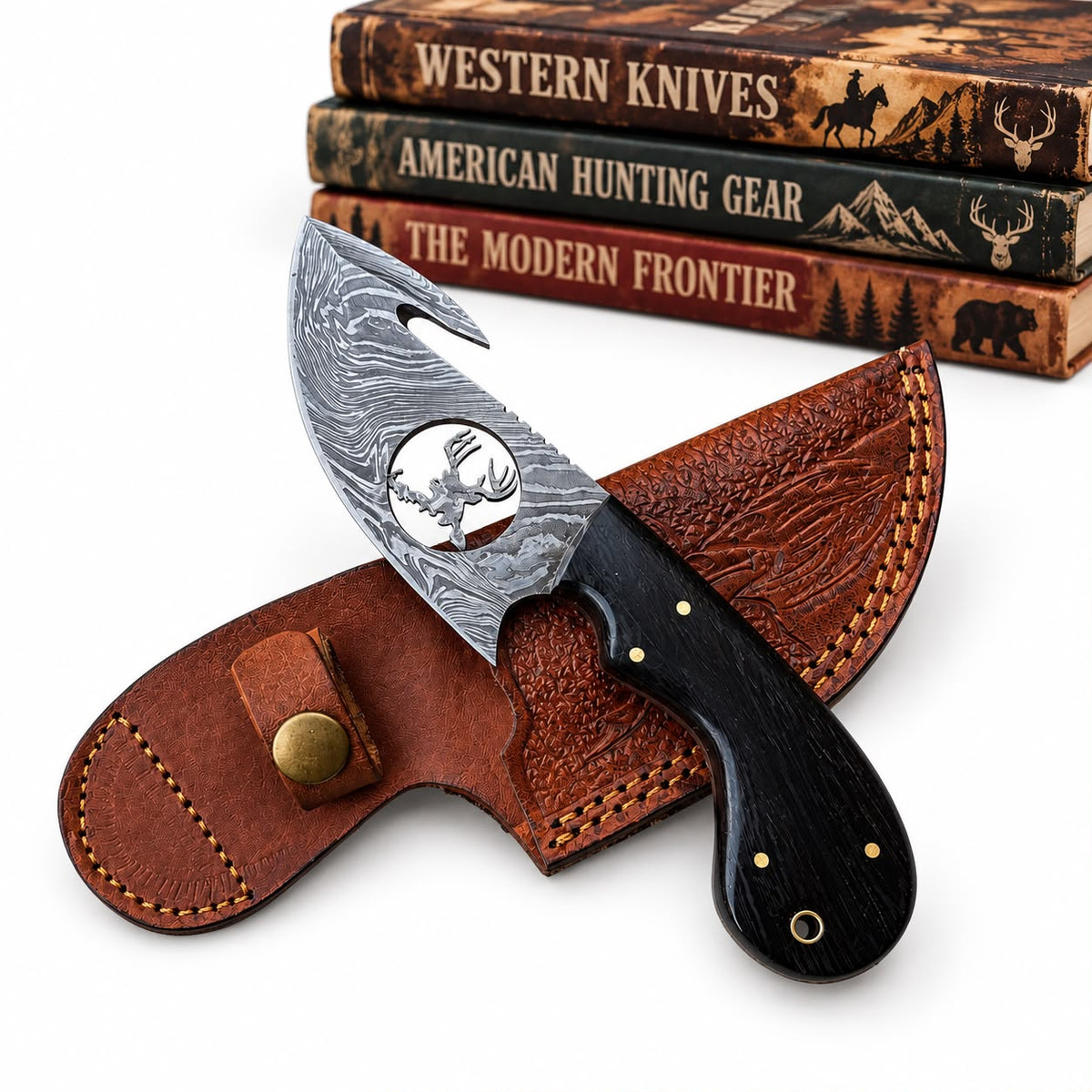 A fixed-blade knife with a patterned steel blade and black handle, displayed in front of a brown leather sheath on a white background, with three stacked western-themed books in the background.