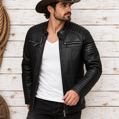 A man wearing a black leather motorcycle jacket over a white t-shirt and dark jeans