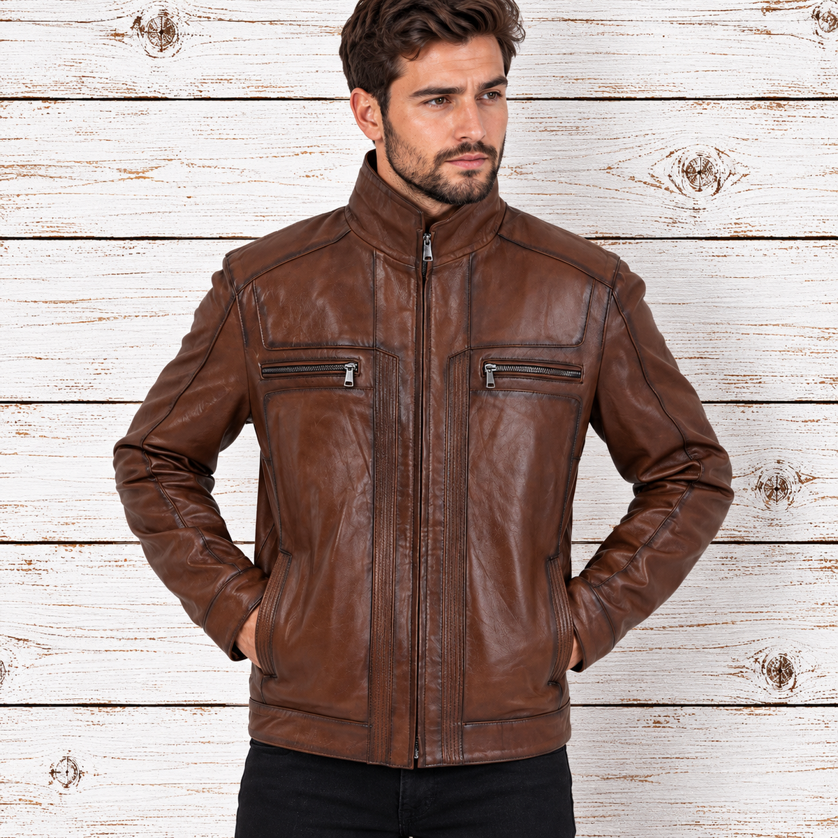 A man wearing a brown leather jacket with a high collar, front zipper, and zippered chest pockets