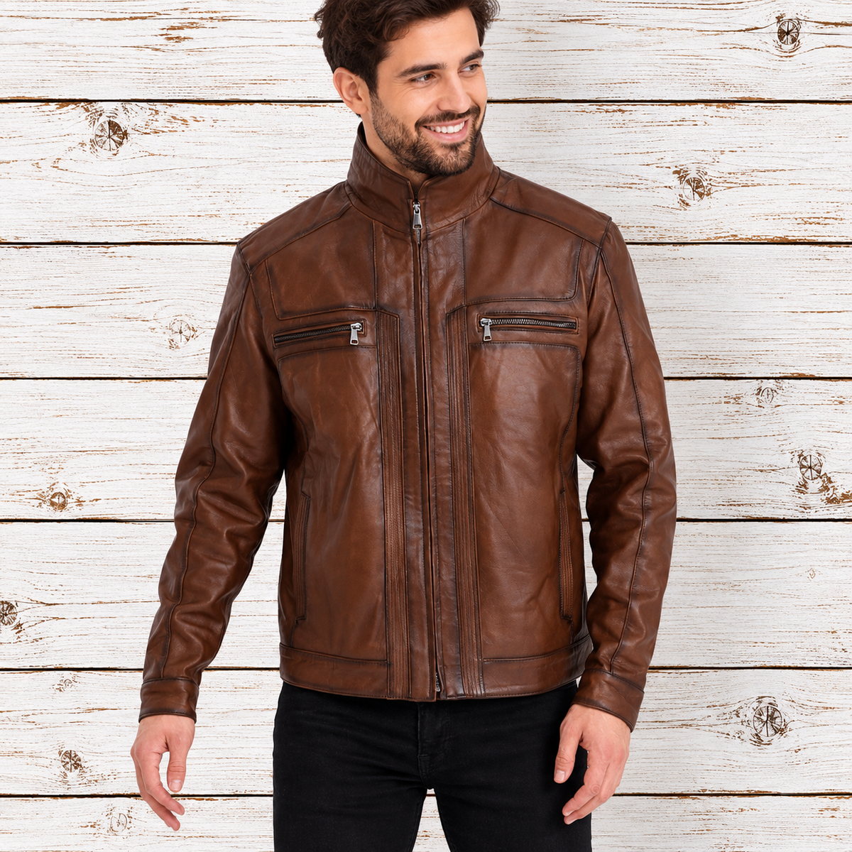 A man wearing a brown leather jacket with a high collar, front zipper, and zippered chest pockets
