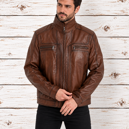 A man wearing a brown leather jacket with a high collar, front zipper, and zippered chest pockets