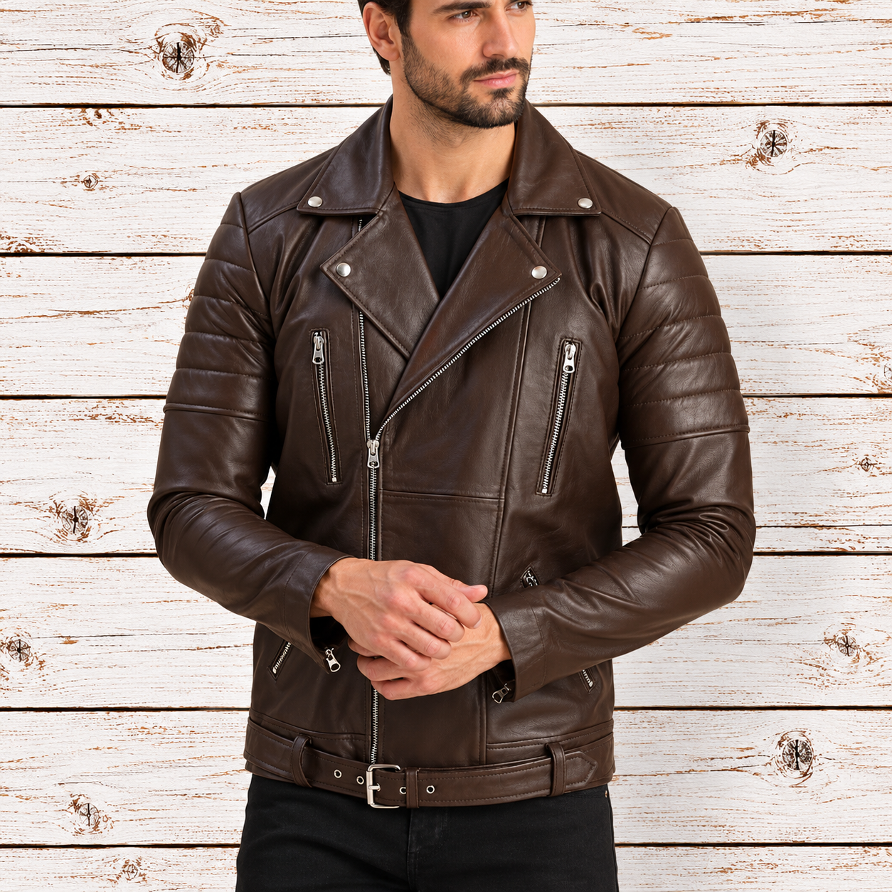 A man wearing a dark brown leather biker jacket with silver zippers and a matching leather belt