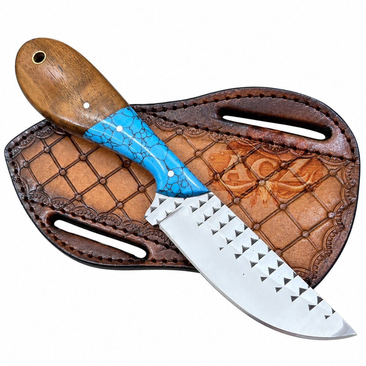 A fixed-blade knife with a polished silver blade featuring a row of triangular cutouts along the edge, a turquoise blue inlay handle, and a brown wooden handle, displayed diagonally on its brown tooled leather sheath against a white background.