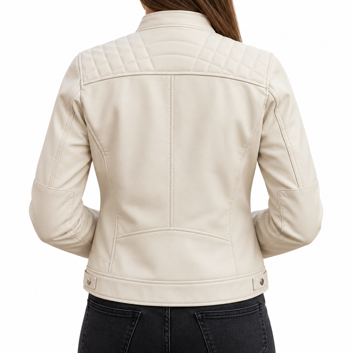 A woman viewed from the back wearing a light cream faux leather jacket with quilted shoulder detailing and snap-button cuffs, paired with black jeans against a plain white background.
