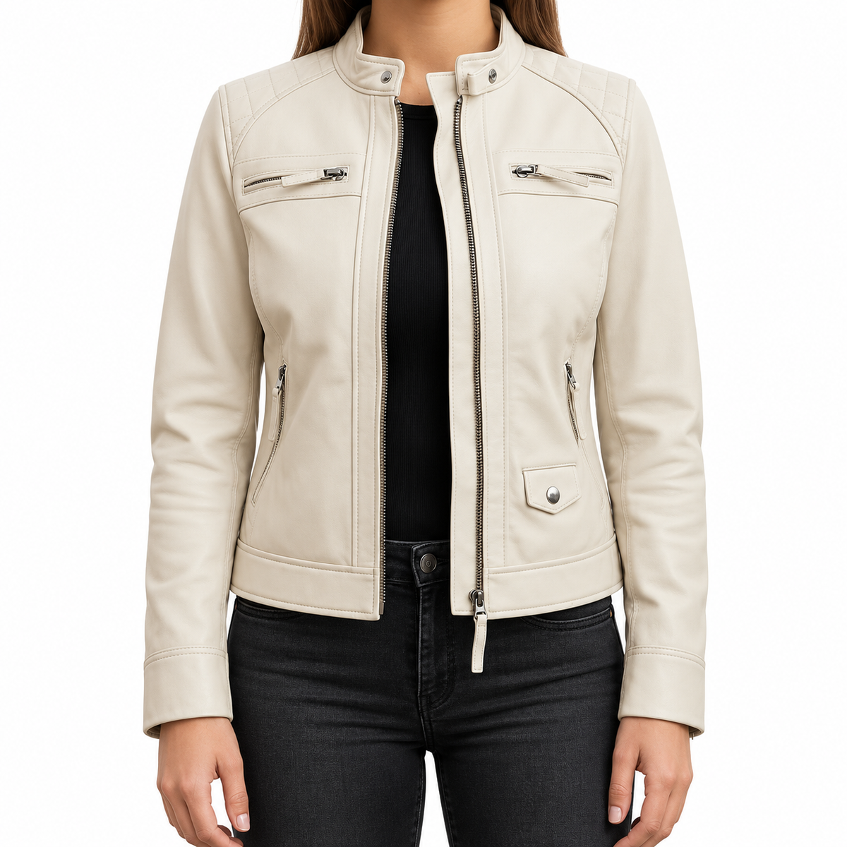 A woman wearing a light cream faux leather motorcycle jacket with silver zippers and snap details, layered over a black top and black jeans, shown against a plain white background.