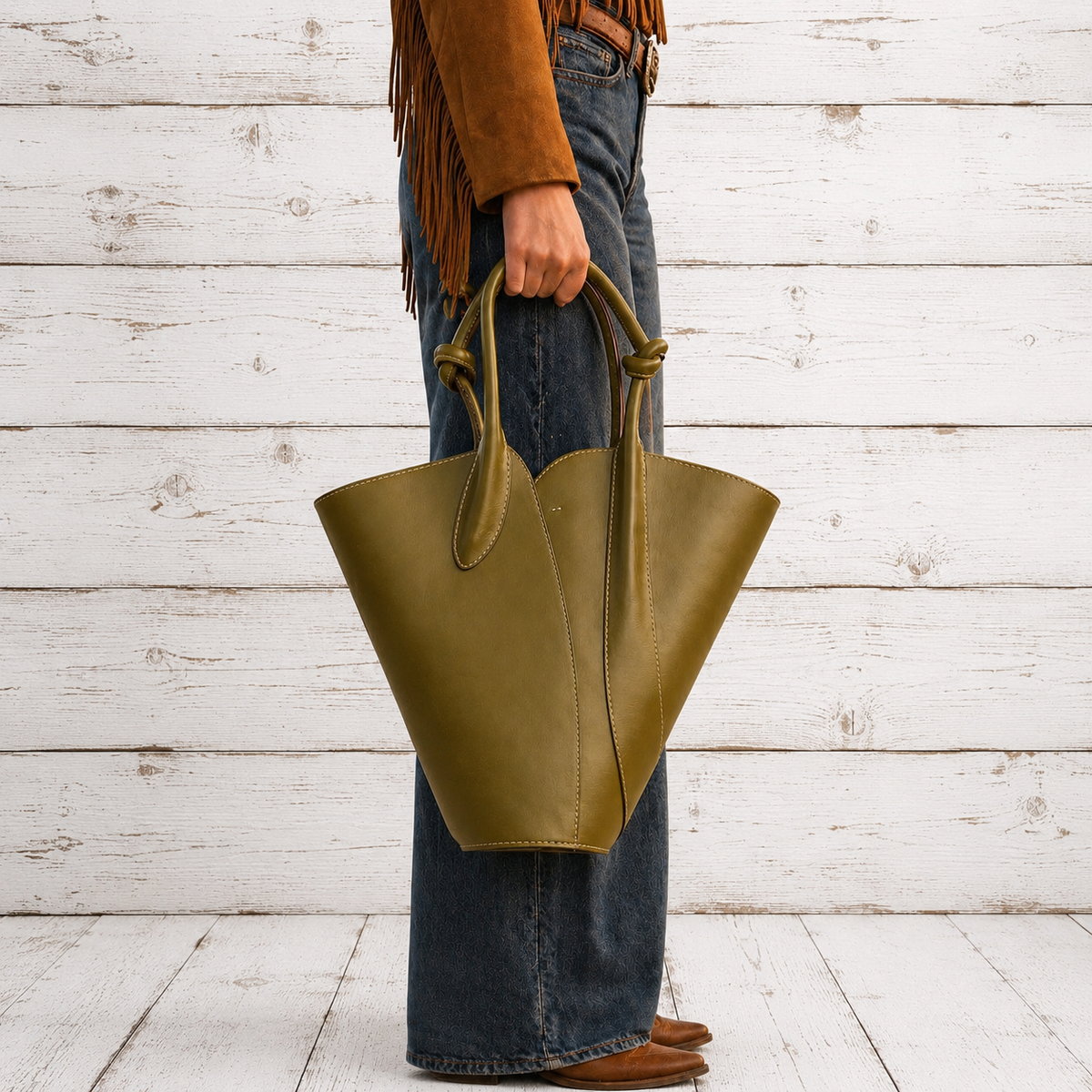 An olive green leather bucket bag with double top handles